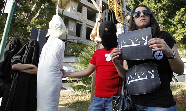  Activists holding a sign that reads “Don’t kill” protest against the execution of a Lebanese man in Saudi Arabia. Photograph: Bilal Hussein/AP